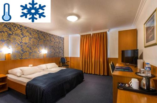 Una cama o camas en una habitación de Hotel ATLANTA Darmstadt