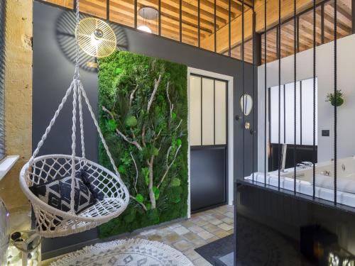 a bathroom with a swing and an aquarium at HOST INN - CŒUR VIEUX LYON & SPA in Lyon