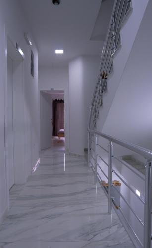 an empty hallway with stairs in a building at Villa Natali in Ohrid