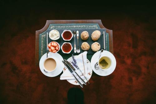 a table with a tray of food and cups of coffee at Nithbank Country Estate 5 Star GOLD in Thornhill