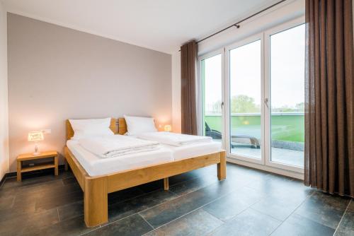 Katil atau katil-katil dalam bilik di Apartmenthaus Aulendorf