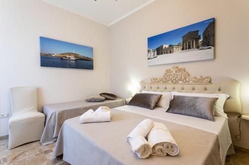 Postel nebo postele na pokoji v ubytování B&B Domus Japigia