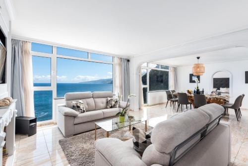 a living room with a view of the ocean at Ocean Vistas 24 in Puerto de la Cruz