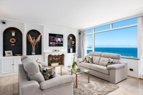 a living room with a view of the ocean at Ocean Vistas 24 in Puerto de la Cruz
