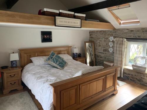 Postel nebo postele na pokoji v ubytování Cavedale Cottage