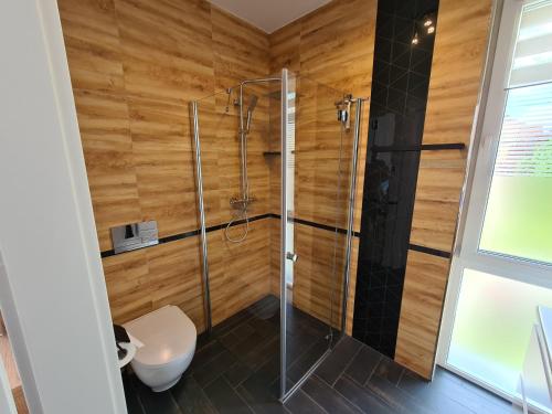 a bathroom with a shower and a toilet at ApartHome K8 Centrum Sulęcin in Sulęcin