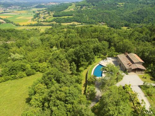 an aerial view of a house with a swimming pool at Fattorie di Celli in Poppi