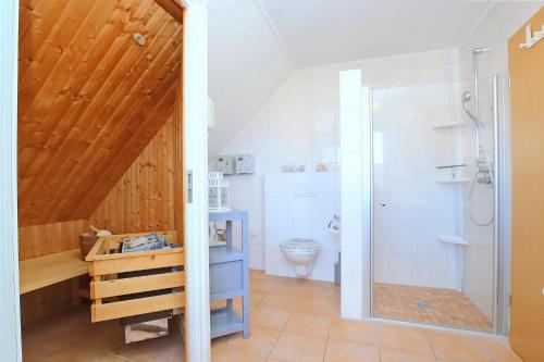 a bathroom with a shower and a toilet at Luisa Wohnung 3 in Boltenhagen