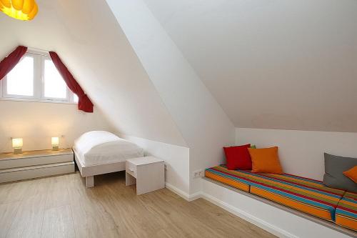 Кровать или кровати в номере Reethaus Am Mariannenweg 12b