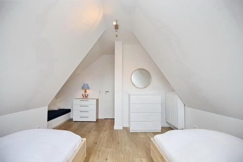 Кровать или кровати в номере Reethaus Am Mariannenweg 19a