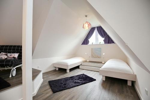 Posteľ alebo postele v izbe v ubytovaní Reethaus Am Mariannenweg 10b