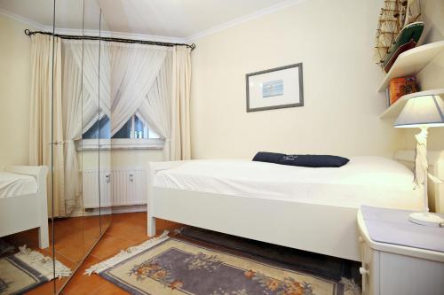 מיטה או מיטות בחדר ב-Atlantik Wohnung 108