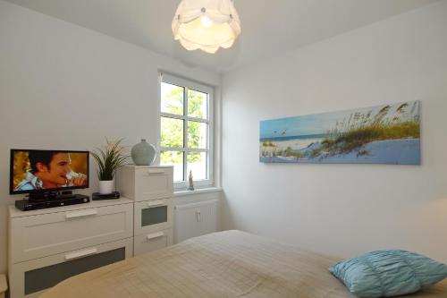 Ένα ή περισσότερα κρεβάτια σε δωμάτιο στο Residenz von Flotow Wohnung 16