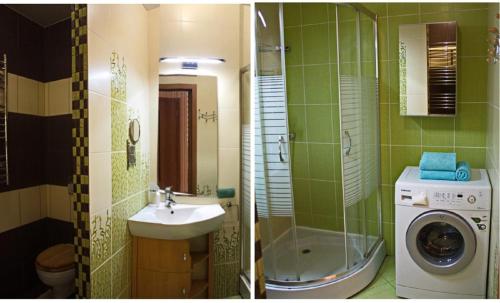 a bathroom with a sink and a washing machine at PaulMarie Apartments on Prs. Stroiteley in Vitebsk