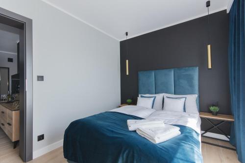 Een bed of bedden in een kamer bij Apartamenty Nord