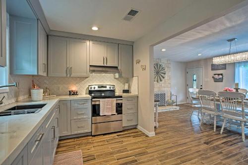 a kitchen with white cabinets and a dining room at Cozy Canton Residence with Great Outdoor Space! in Canton