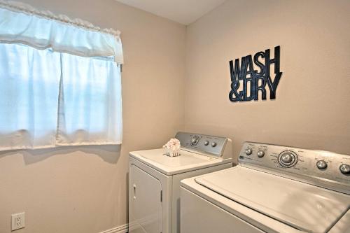 a laundry room with a washing machine and a window at Cozy Canton Residence with Great Outdoor Space! in Canton