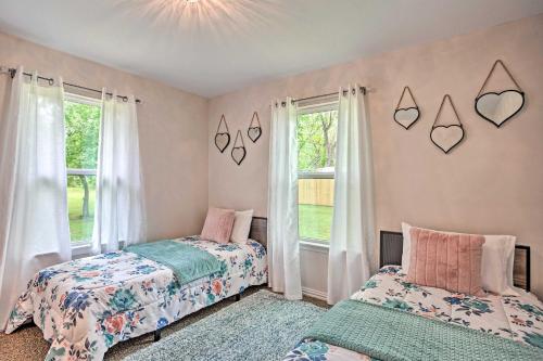 a bedroom with two beds and a window at Cozy Canton Residence with Great Outdoor Space! in Canton