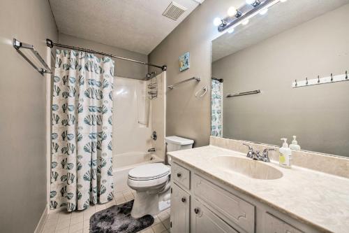 a bathroom with a sink and a toilet and a shower at PCB Resort Condo with Private Balcony and 3 Pools! in Panama City Beach