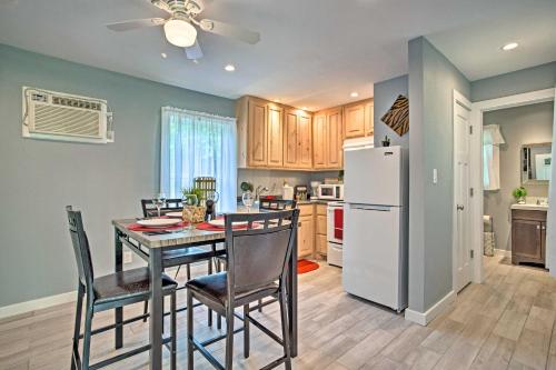 a kitchen and dining room with a table and a refrigerator at Couples Retreat In Canton with Patio, Trail and Yard! in Canton