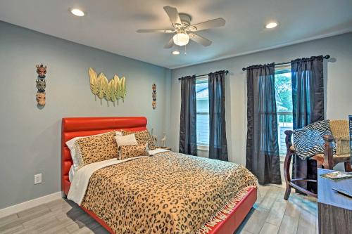 a bedroom with a bed and a ceiling fan at Couples Retreat In Canton with Patio, Trail and Yard! in Canton