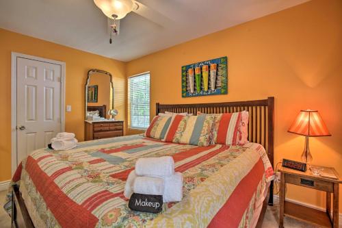 a bedroom with a bed with a chair and a mirror at Cloud 9 On The Coast Less Than 1 Mi to Beach! in Waveland