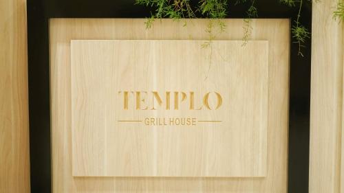 a sign that says tempurio gell house at Rivoli Suites in Hurghada