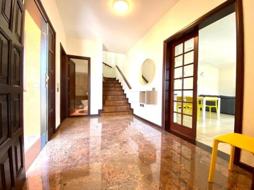 a hallway of a house with a door and a staircase at Vivienda Vacacional Villa El Mirador in San Sebastián de la Gomera
