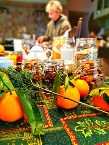 a table with oranges and other food on it at Old Bruges B&B in Bruges