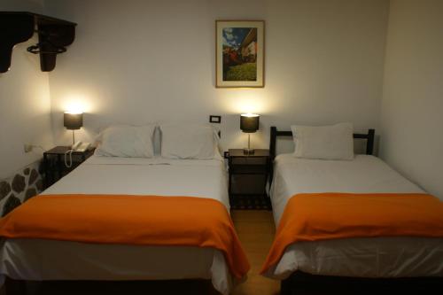 Postel nebo postele na pokoji v ubytování Hotel Samanapaq