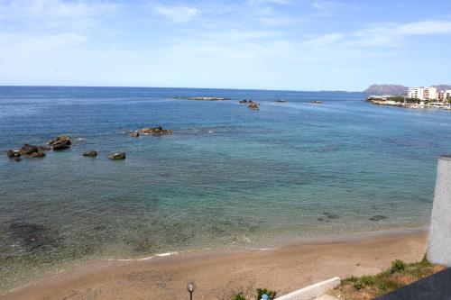 a view of a beach with rocks in the water at Klinakis Beach Hotel in Chania Town