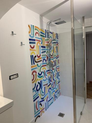 a shower with a glass door in a bathroom at CasaTua in Amalfi