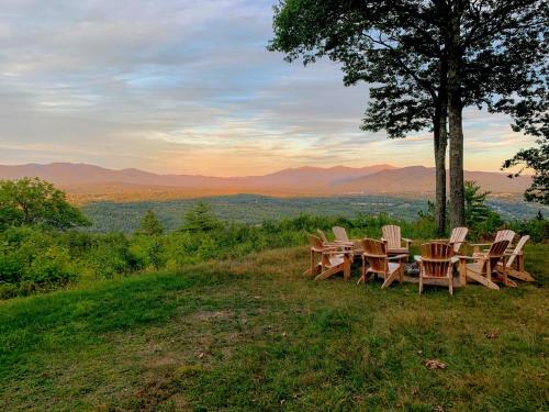 a group of chairs sitting on top of a hill at RL Breathtaking views and grand unique style private mountain retreat 4WD recommended in Whitefield