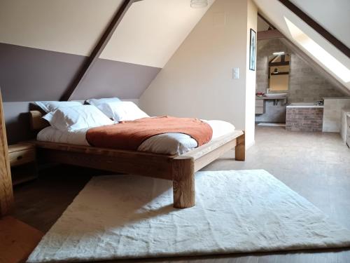 เตียงในห้องที่ Gîte de la Motte