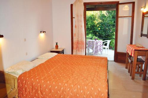 A bed or beds in a room at Beach house Yannis in Agios Gordios beach on Corfu