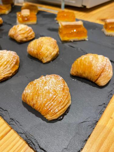 a baking tray with several croissants on it at 4heavens_naples in Naples