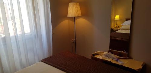 Katil atau katil-katil dalam bilik di Rooms & Apartment STELIO