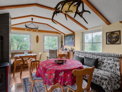 a living room with a table and a couch at Holiday home near the Oberhof ski resort in Kurort Steinbach-Hallenberg