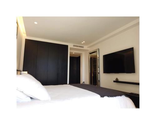 Tempat tidur dalam kamar di Appartement Villa Cassis