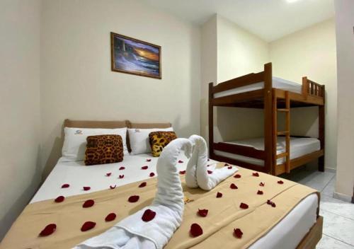 Ένα ή περισσότερα κρεβάτια σε δωμάτιο στο Pousada Mar Suites