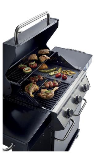 a grill with meat and other food on it at UIM Mediterraneo Segorbe 1 Wifi in Puerto de Sagunto