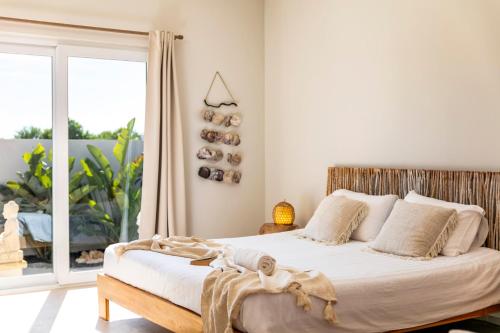 Ένα ή περισσότερα κρεβάτια σε δωμάτιο στο Casa Tuia Resort