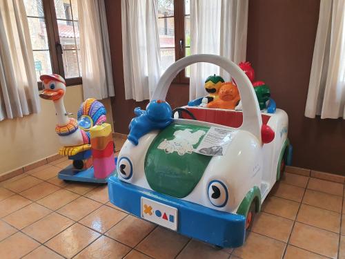 a childs toy car in a room at HOTEL MASIA EL MOLINETE in Mora de Rubielos