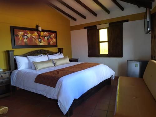 Postel nebo postele na pokoji v ubytování Hotel Las Rocas Resort Villanueva