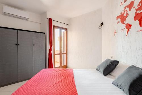 Кровать или кровати в номере Casa Lu Maccu - Sea View Apartment