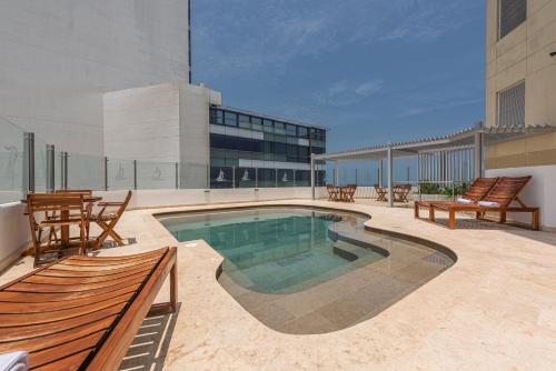 a swimming pool on top of a building at Hotel Regatta Cartagena in Cartagena de Indias