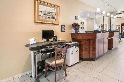 an office with a desk with a computer on it at Comfort Inn Newport in Newport