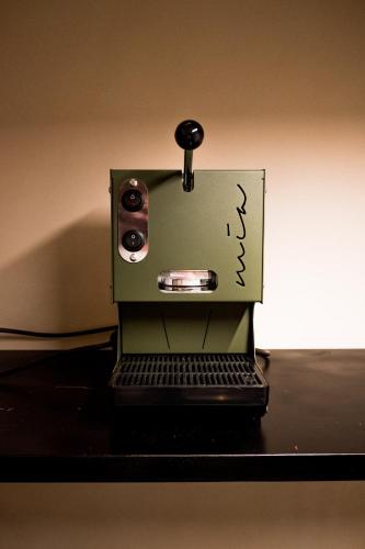 a coffee maker sitting on top of a table at Dimora 19.92 in Monopoli
