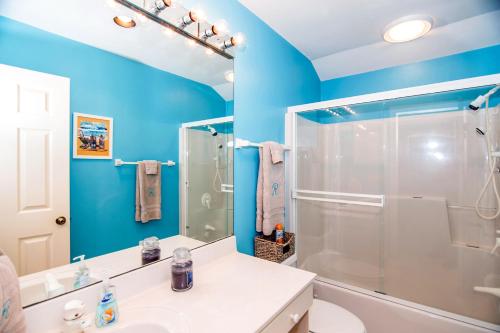 a bathroom with a shower and a sink at Slow Drift in Edisto Beach