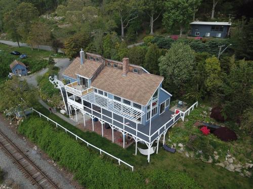an overhead view of a large blue house with a roof at Spectacular home with a amazing ocean - river view in Groton